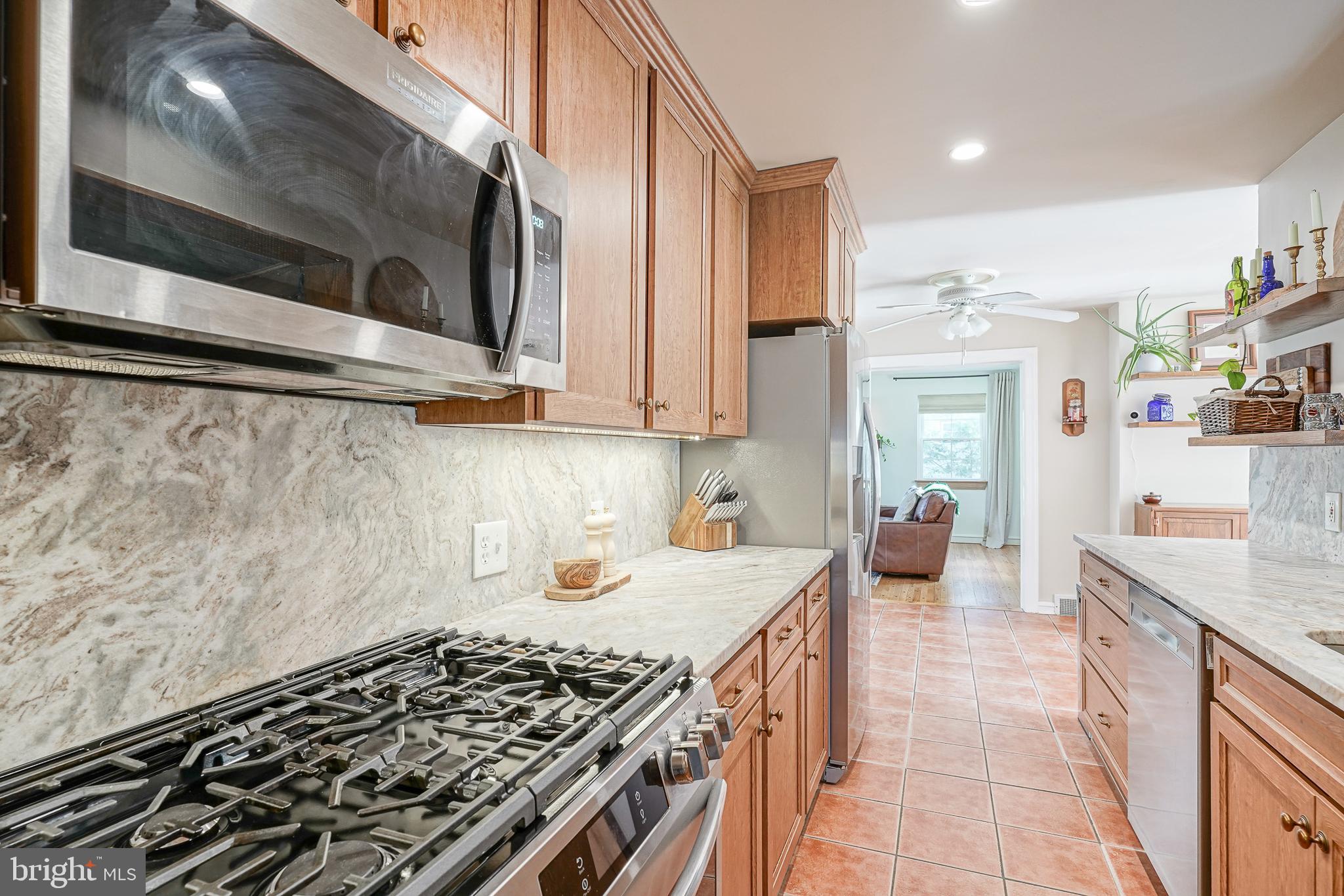 64 Pancoast Boulevard Delran, NJ 08075 - Photo 18 of 45 a kitchen with stainless steel appliances a stove a sink and a microwave