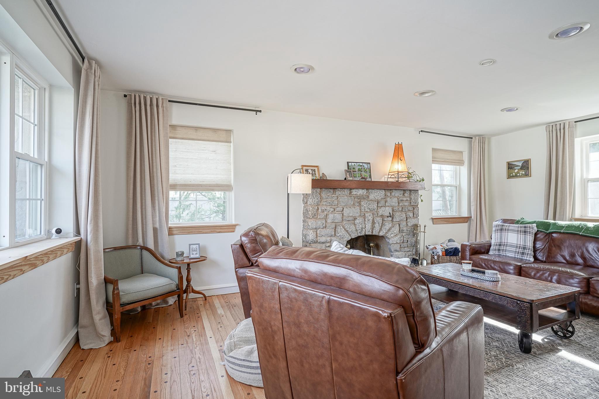 64 Pancoast Boulevard Delran, NJ 08075 - Photo 5 of 45 a living room with furniture a fireplace and large windows