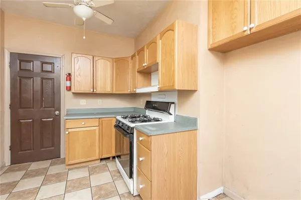 a kitchen with a stove and a refrigerator
