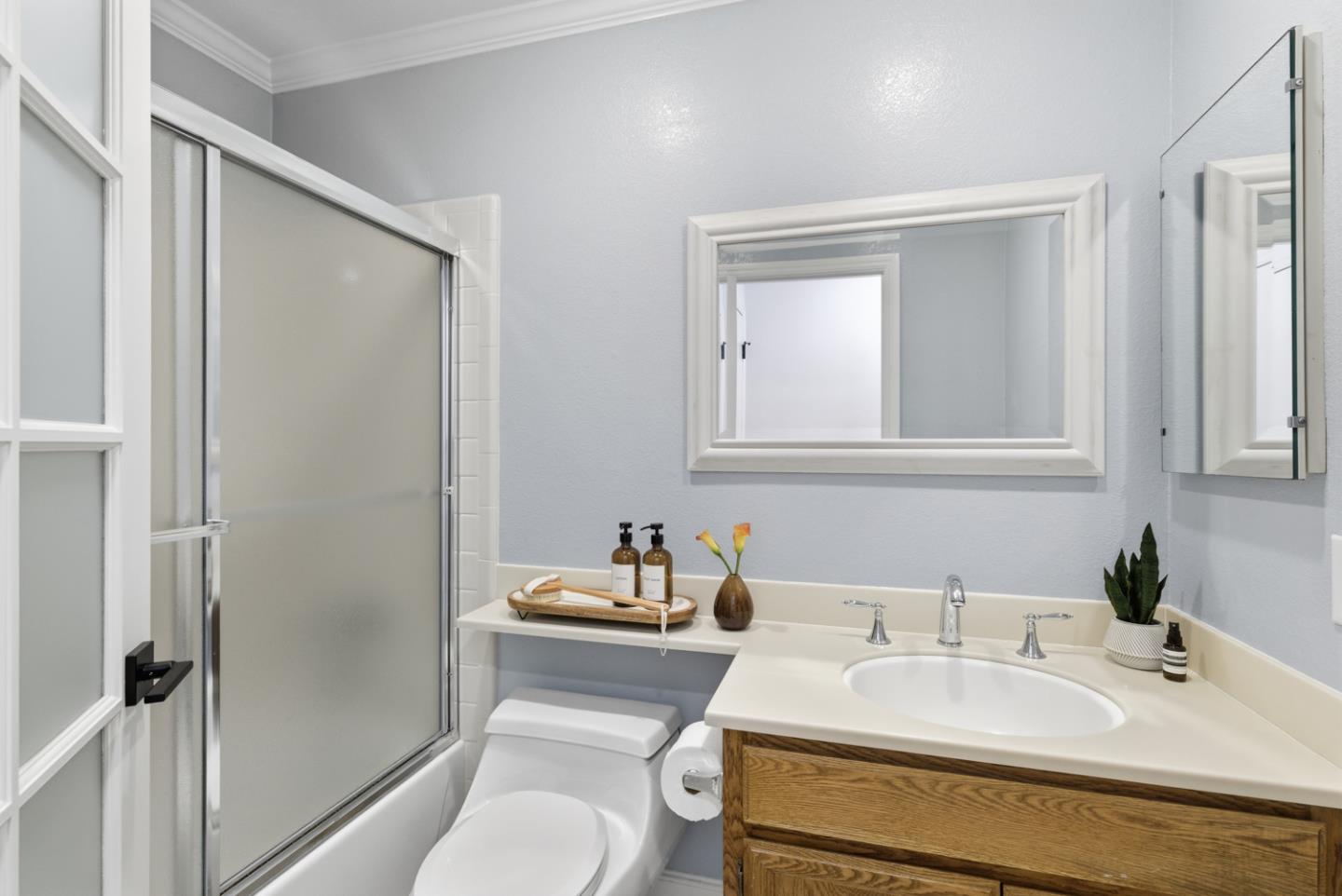 1669 Geary Road Walnut Creek, CA 94597 - Photo 21 of 39 a bathroom with a sink toilet and vanity