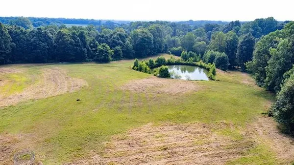 a view of a lake with a yard