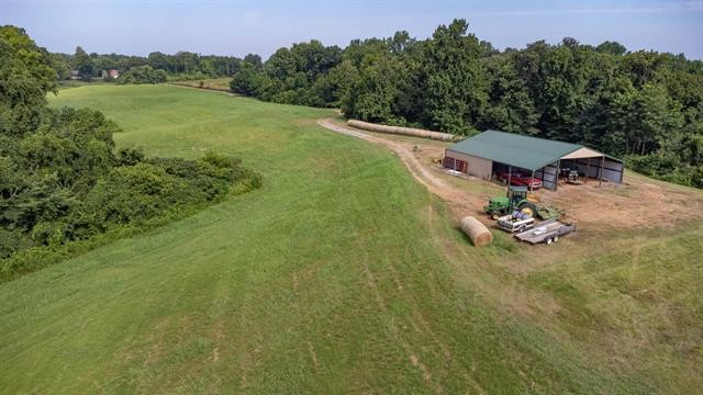 3854 Edith-Nankipoo Road Ripley, TN 38063 - Photo 10 of 15 a view of a lake with a yard and mountain view