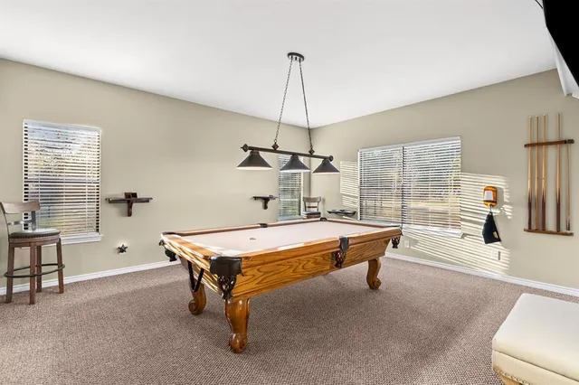 a utility room with dryer washer and a view of living room