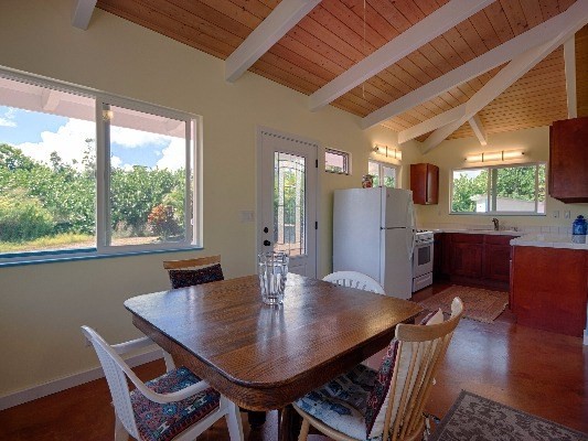 14-4825 La Maloo Road Pahoa, HI 96778 - Photo 13 of 25 a view of a dining room with furniture window and wooden floor