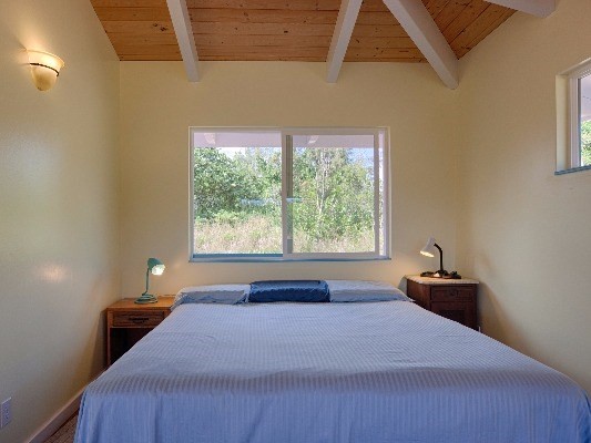 14-4825 La Maloo Road Pahoa, HI 96778 - Photo 16 of 25 a bedroom with a bed and window
