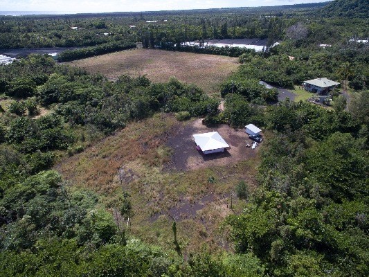 14-4825 La Maloo Road Pahoa, HI 96778 - Photo 23 of 25 an aerial view of a house with a yard and lake view