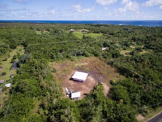 14-4825 La Maloo Road Pahoa, HI 96778 - Photo 5 of 25 an aerial view of a house with a yard