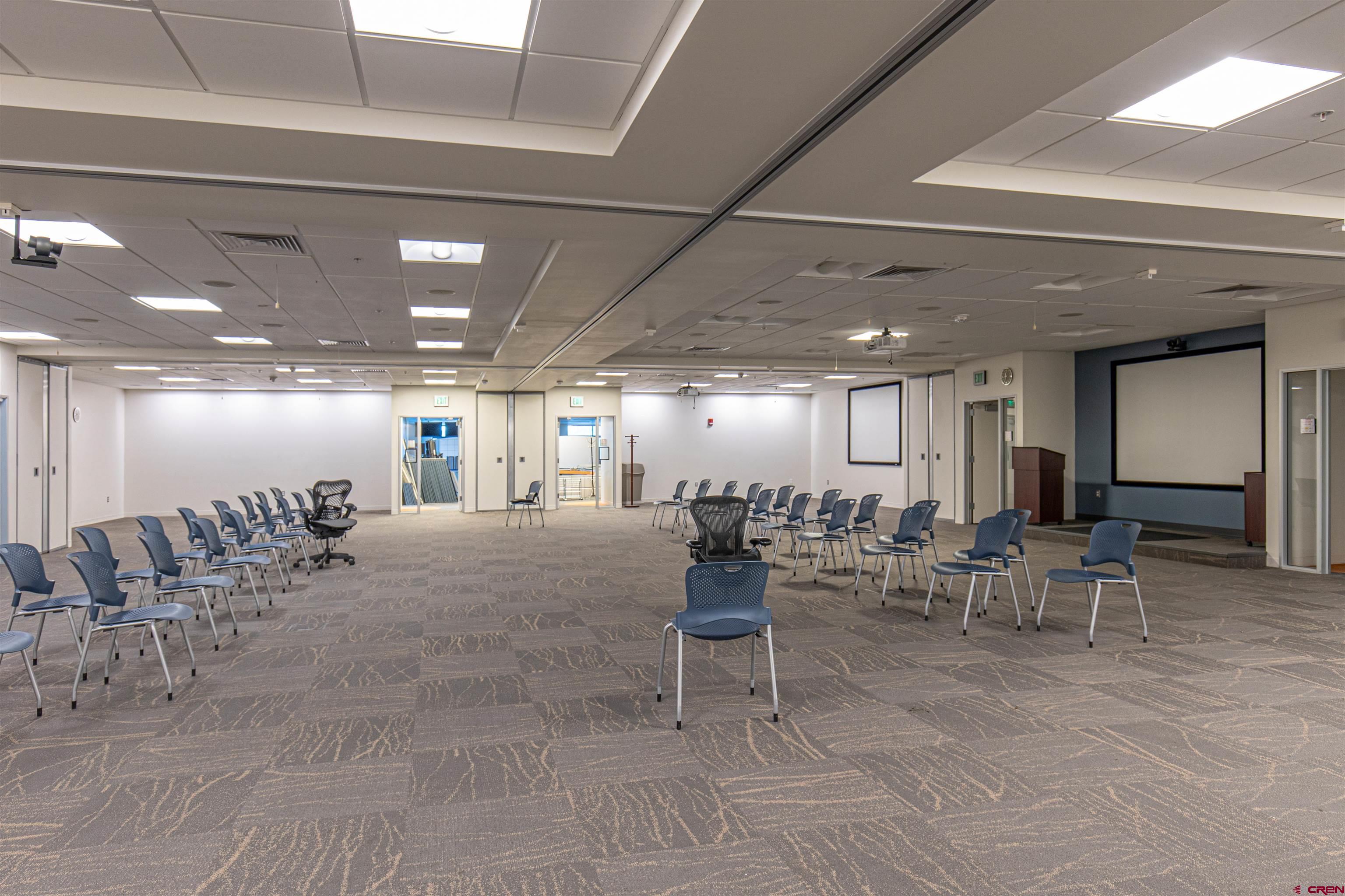 380 Airport Road, Unit A Ignacio, CO 81137 - Photo 12 of 26 a room with lots of tables a chairs and a potted plant