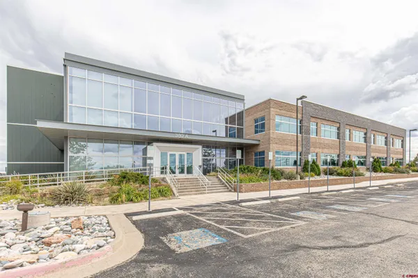 a front view of a building with street view
