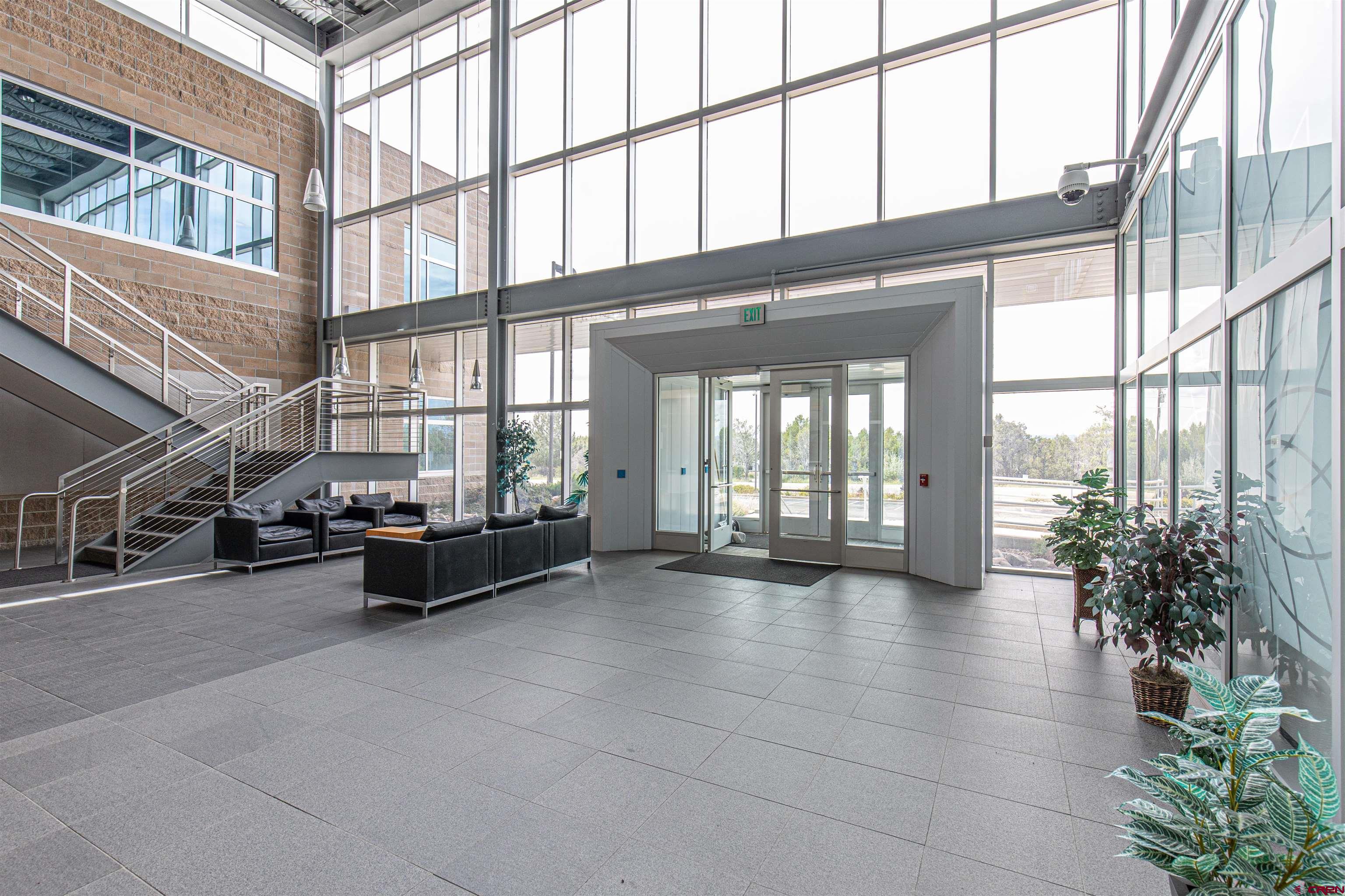 380 Airport Road, Unit A Ignacio, CO 81137 - Photo 7 of 26 a lobby with furniture and floor to ceiling windows