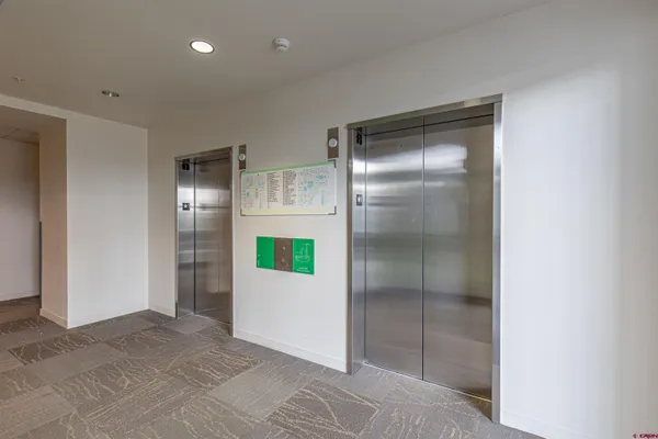 a view of a livingroom with furniture and a table