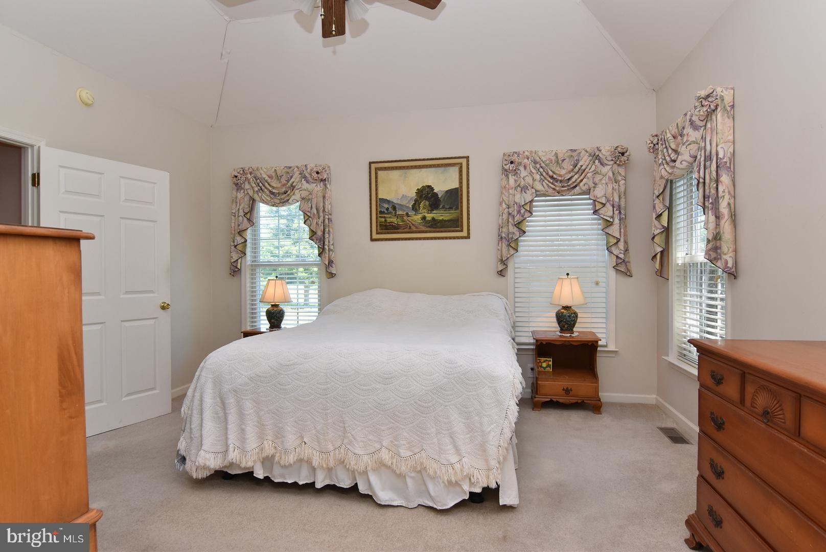 30849 Old Landing Road Laurel, DE 19956 - Photo 15 of 27 a bedroom with a bed and a couch