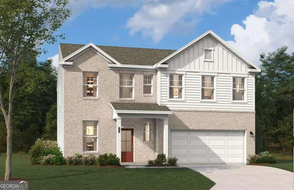 a front view of a house with a yard and garage