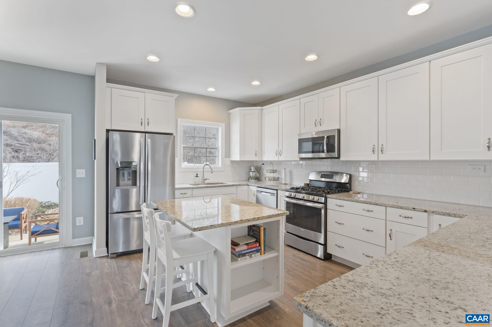2424 Winthrop Drive Charlottesville, VA 22911 - Photo 11 of 36 a kitchen with stainless steel appliances granite countertop a refrigerator stove microwave and sink