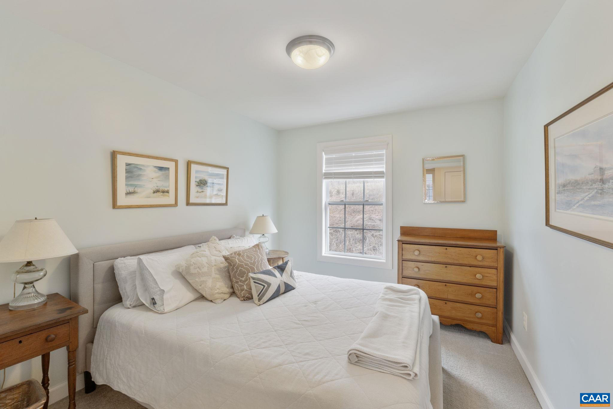 2424 Winthrop Drive Charlottesville, VA 22911 - Photo 23 of 36 a bedroom with a bed and a window
