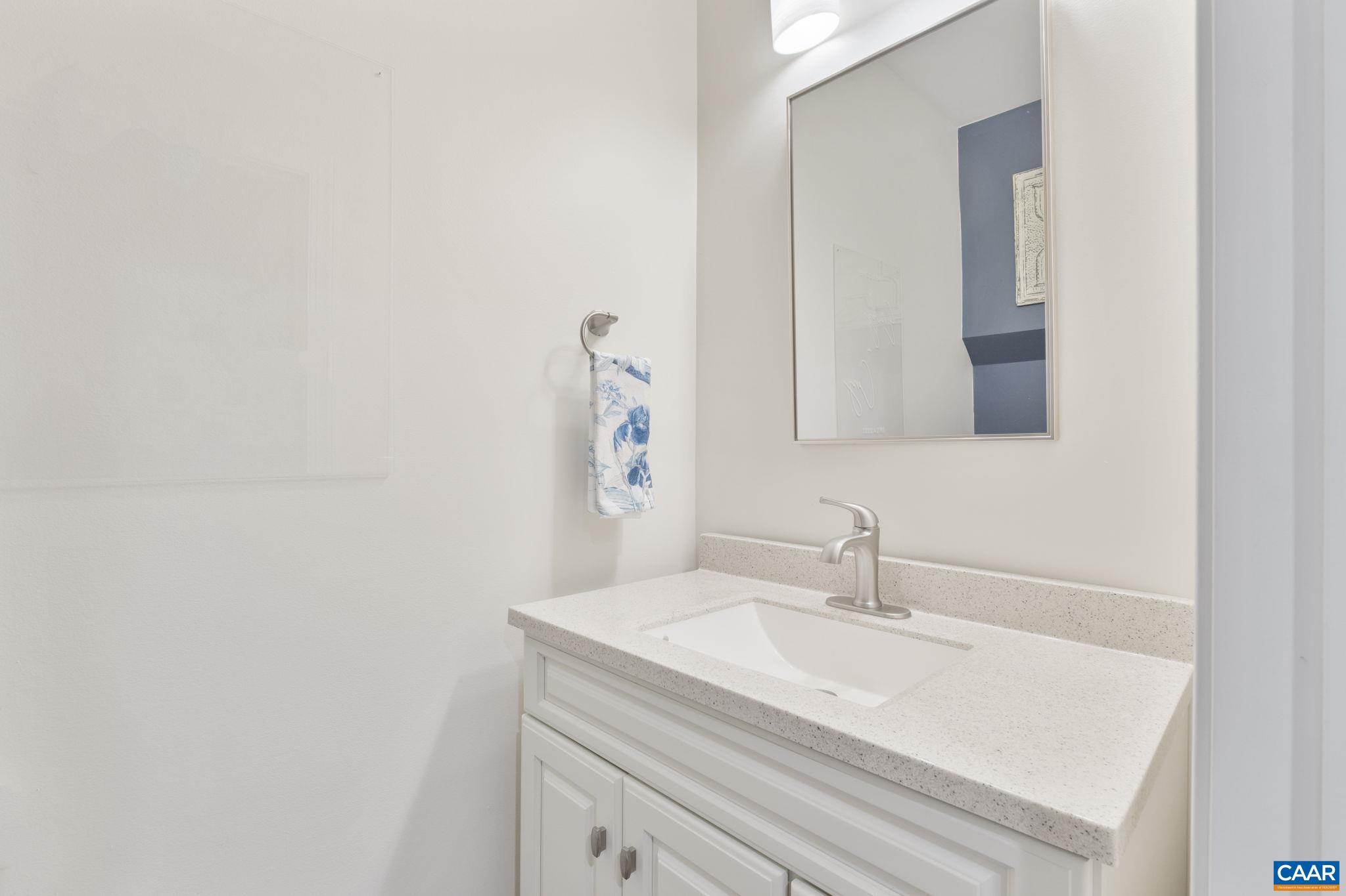 2424 Winthrop Drive Charlottesville, VA 22911 - Photo 26 of 36 a bathroom with a sink and a mirror