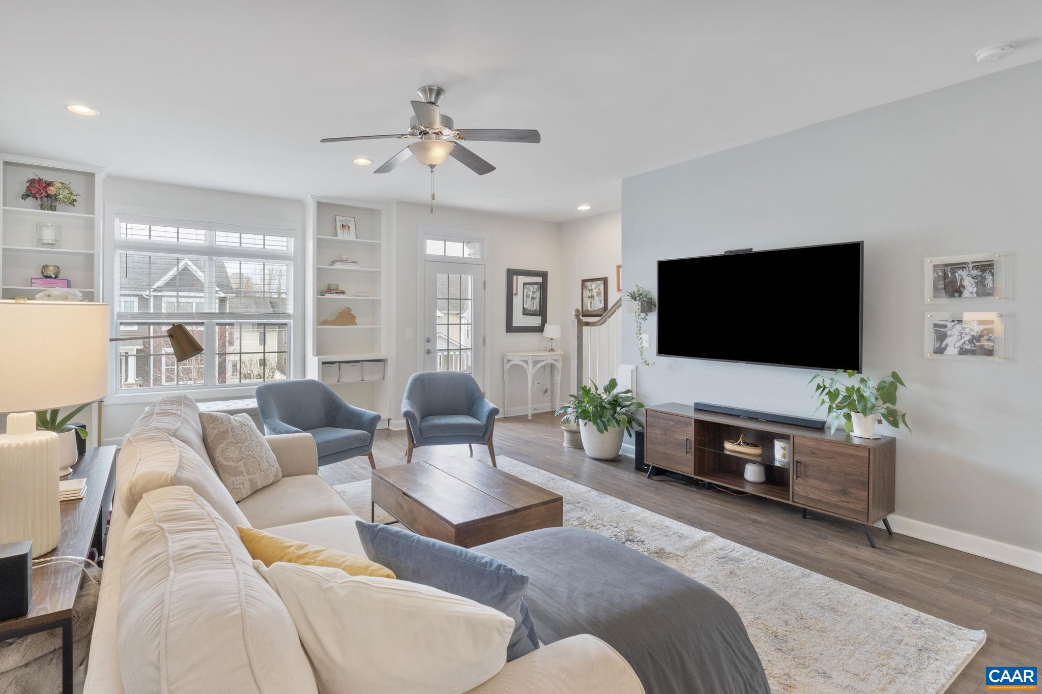 2424 Winthrop Drive Charlottesville, VA 22911 - Photo 8 of 36 a living room with furniture and a flat screen tv