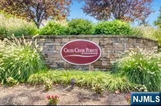 a sign that is on a wooden fence