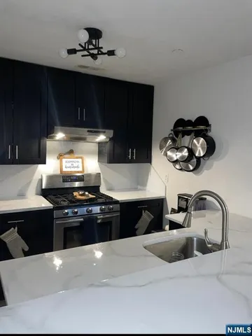 a kitchen with a stove and a kitchen island
