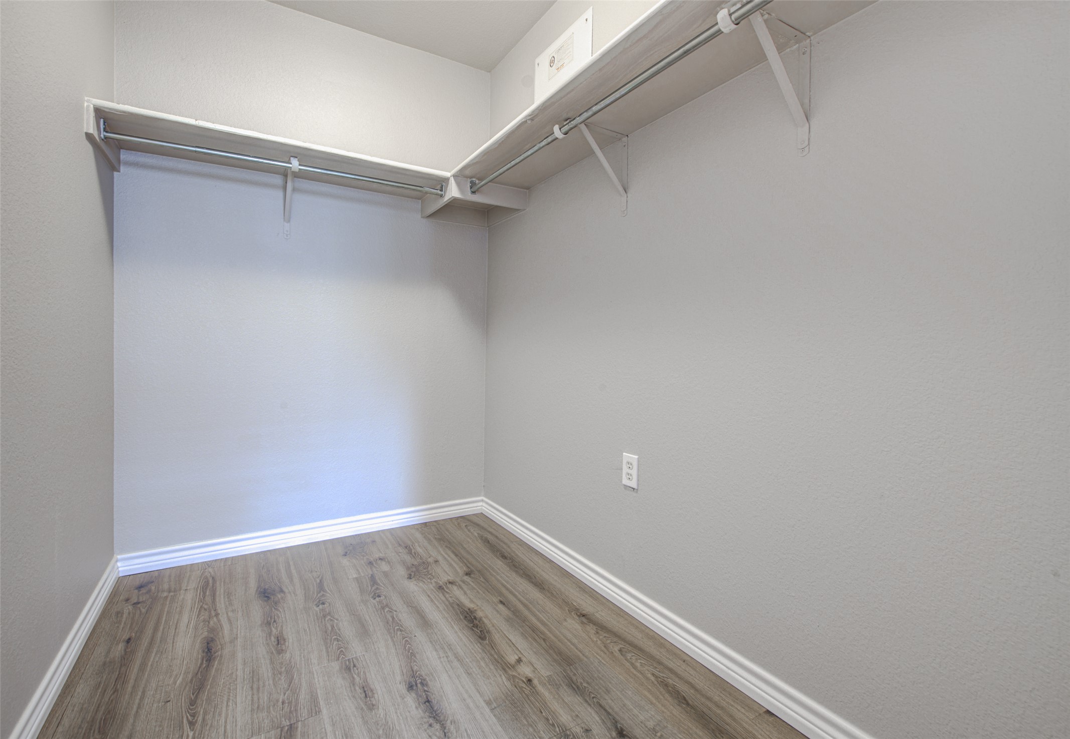 6709 Doyal Drive Austin, TX 78747 - Photo 20 of 22 Walk in closet featuring light wood-type flooring
