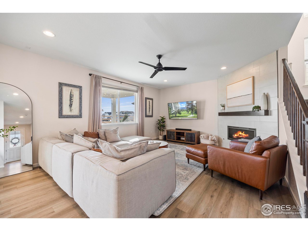 951 Rustling Street Windsor, CO 80550 - Photo 13 of 47 a living room with furniture and a large window