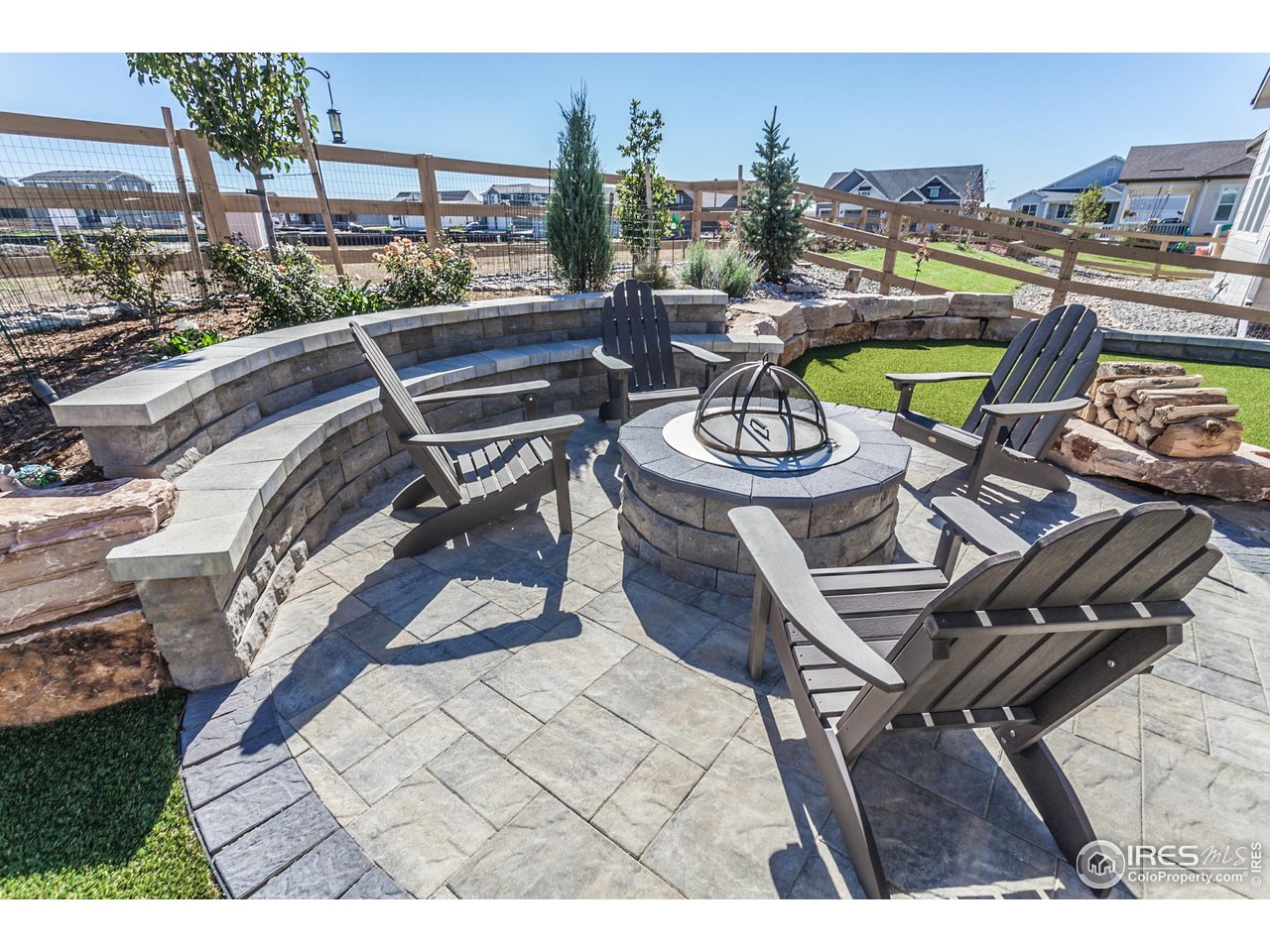 951 Rustling Street Windsor, CO 80550 - Photo 39 of 47 a view of a chairs and table on the terrace