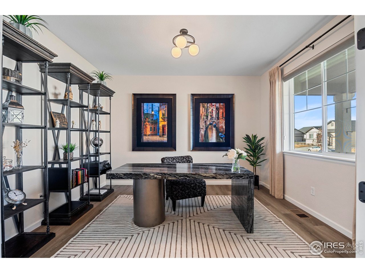 951 Rustling Street Windsor, CO 80550 - Photo 4 of 47 a dining room with lots of furniture and windows