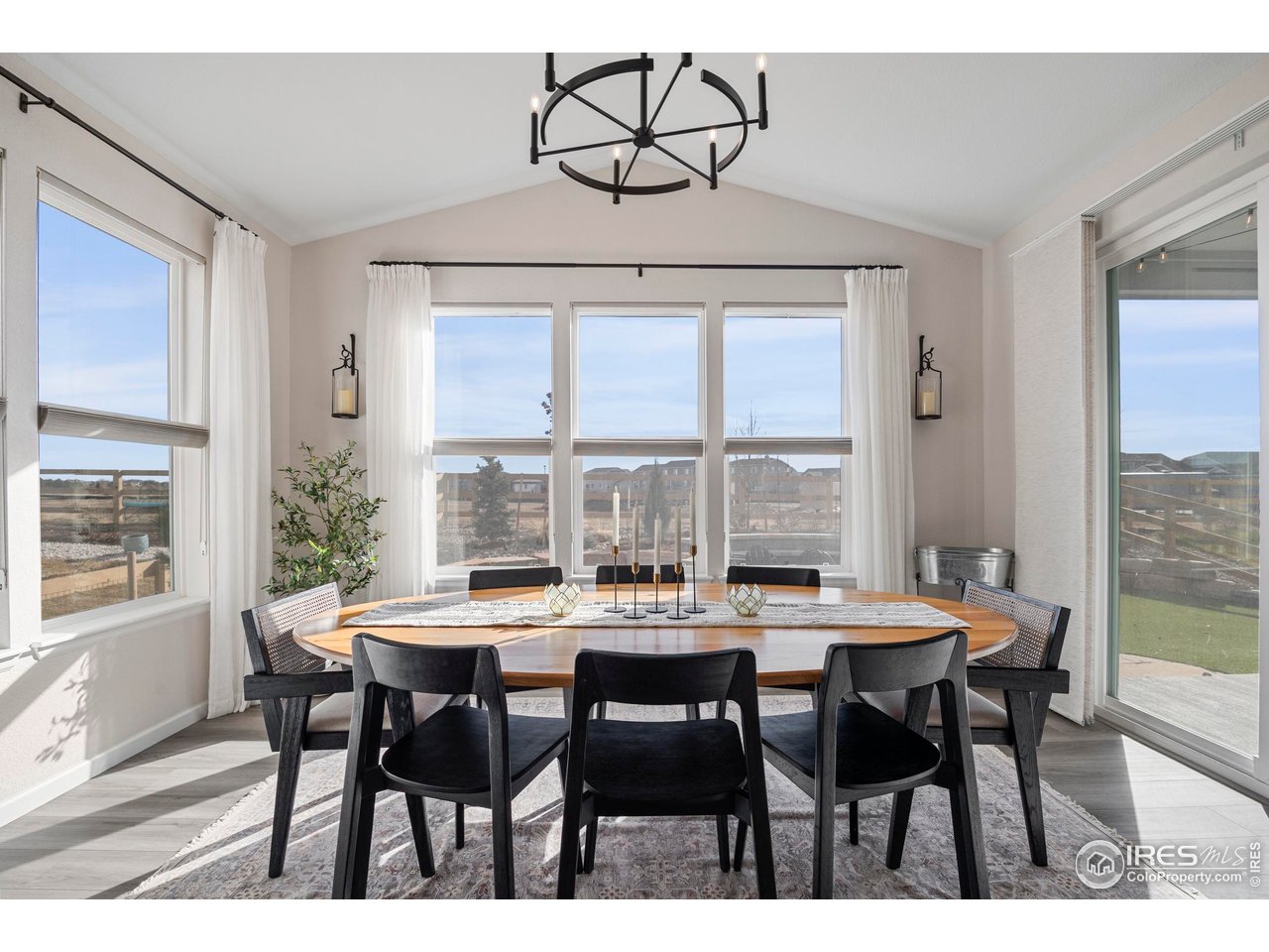 951 Rustling Street Windsor, CO 80550 - Photo 8 of 47 a view of a dining room with furniture window and outside view