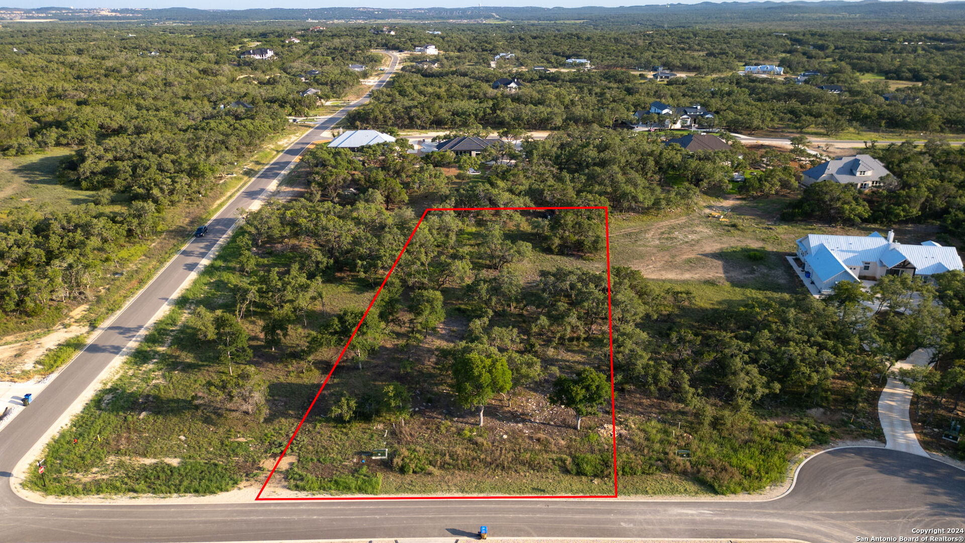 711 Blaze Rdg Boulevard Bulverde, TX 78163 - Photo 2 of 16 an aerial view of residential houses with outdoor space and trees