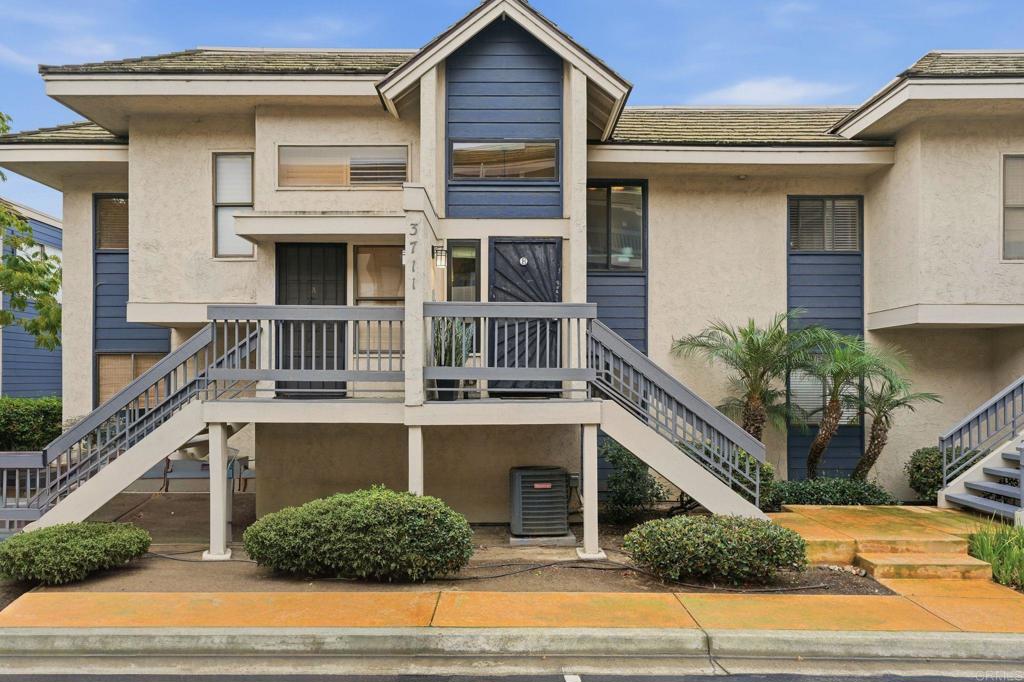 3711 Balboa Terrace, Unit B San Diego, CA 92117 - Photo 15 of 39 a view of a house with a window and potted plants