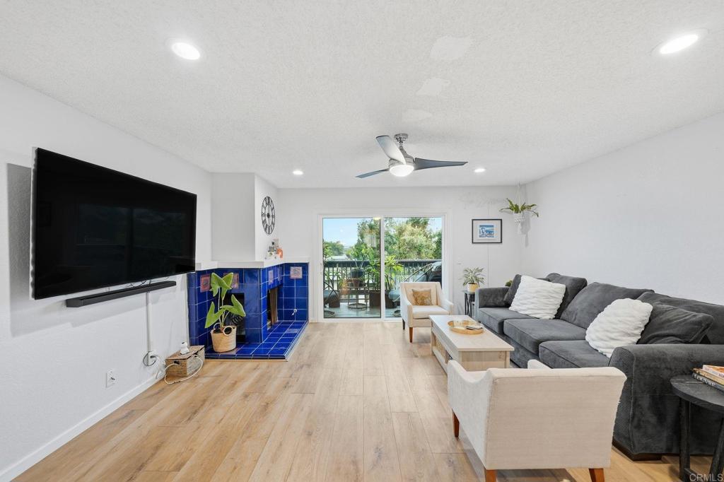 3711 Balboa Terrace, Unit B San Diego, CA 92117 - Photo 2 of 39 a living room with furniture and a flat screen tv