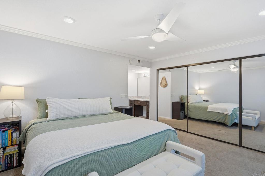 3711 Balboa Terrace, Unit B San Diego, CA 92117 - Photo 23 of 39 a bedroom with a large bed and a mirror