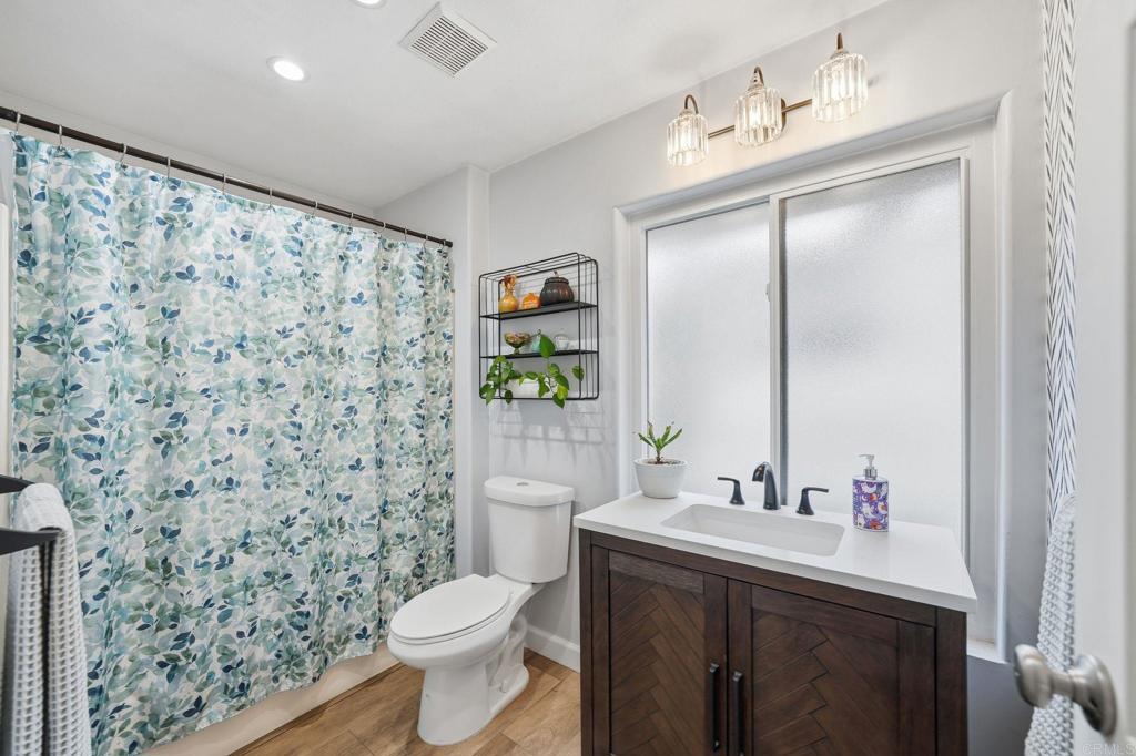 3711 Balboa Terrace, Unit B San Diego, CA 92117 - Photo 29 of 39 a bathroom with a sink toilet and shower