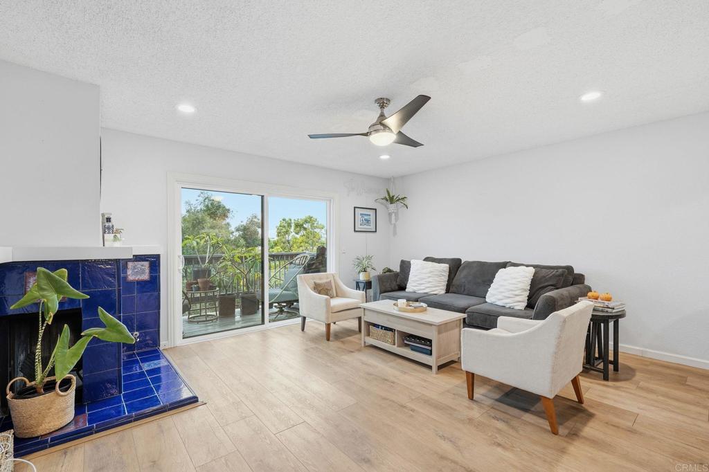 3711 Balboa Terrace, Unit B San Diego, CA 92117 - Photo 4 of 39 a living room with furniture and a large window