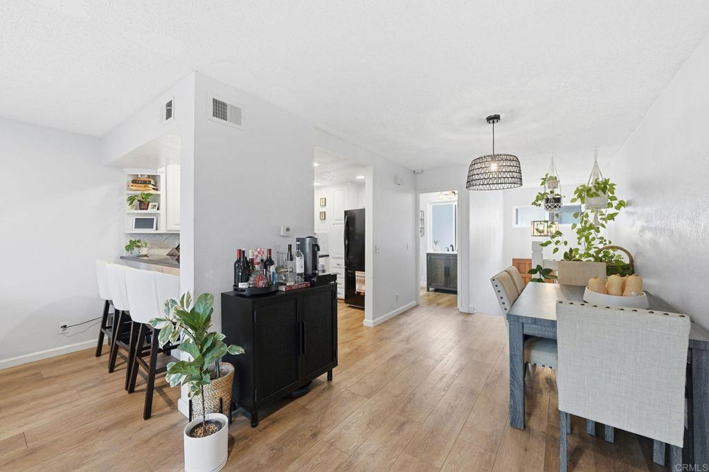 3711 Balboa Terrace, Unit B San Diego, CA 92117 - Photo 7 of 39 a view of a dining room with furniture and wooden floor