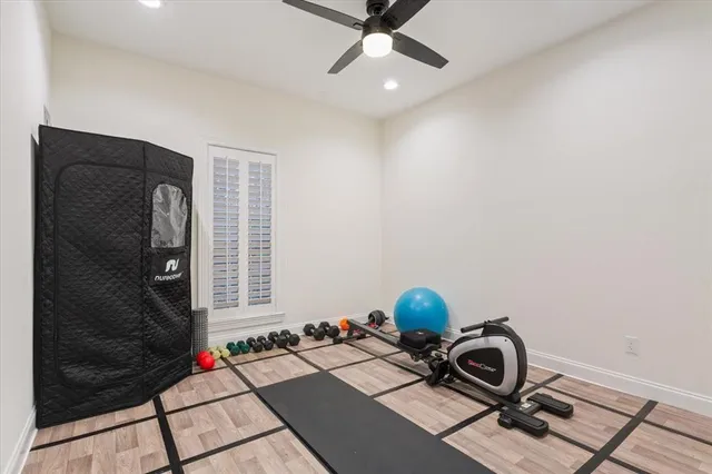 a view of a workspace with furniture and a gate