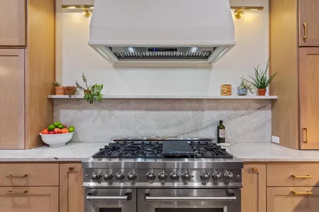 a kitchen with a stove and cabinets