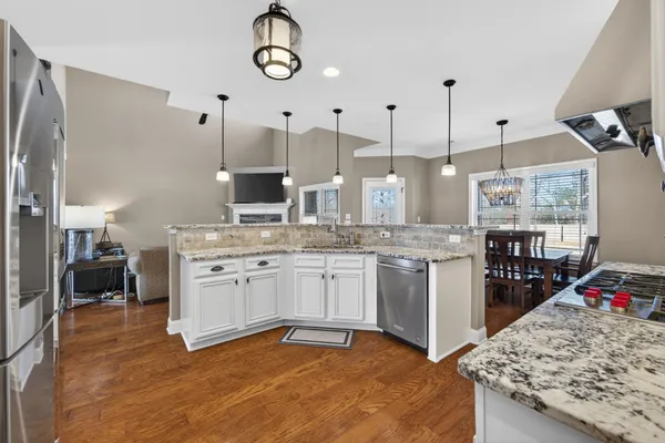 a stove top oven sitting inside of a kitchen
