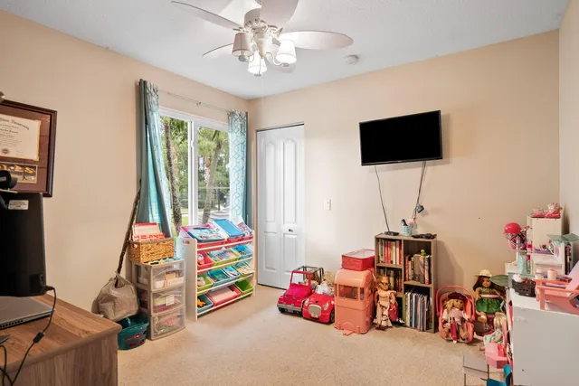 a children room with toys and a flat screen tv