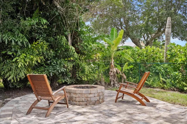 a chairs and a table in a garden