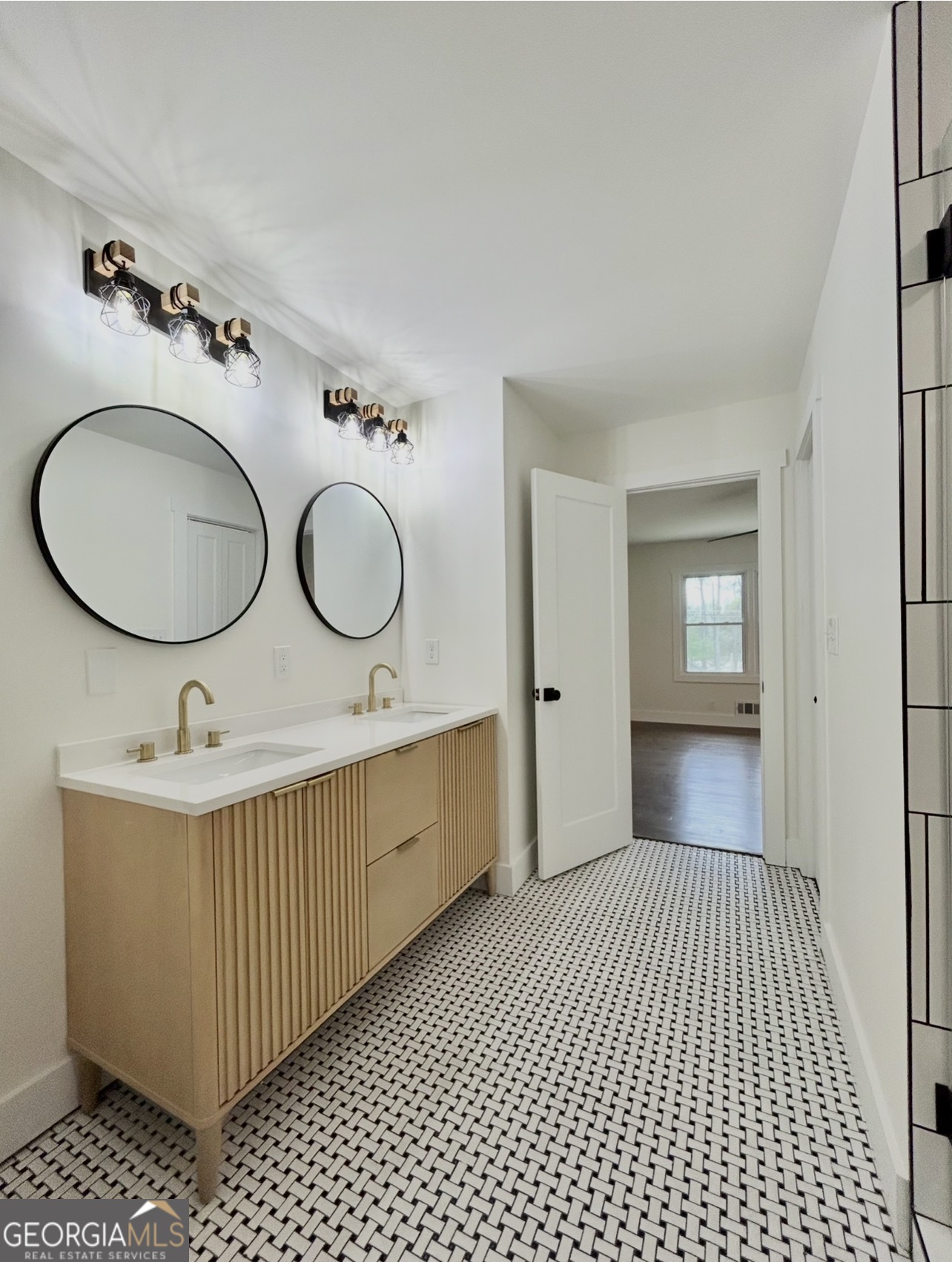 1742 Constitution Road Southeast Atlanta, GA 30316 - Photo 23 of 32 a bathroom with a sink a mirror and a toilet