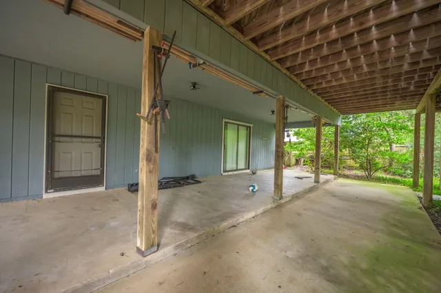 a kitchen with cabinets appliances a sink and a window
