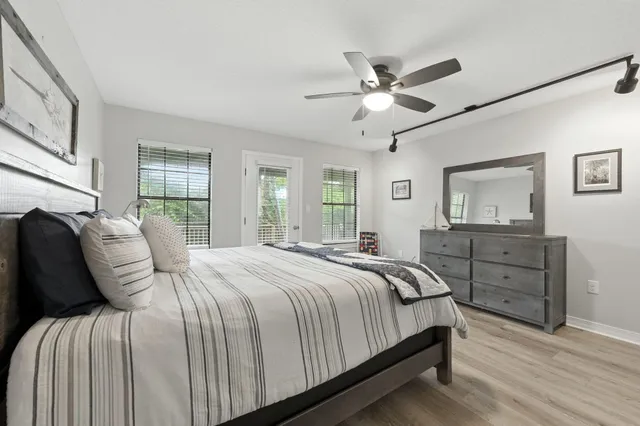 a white toilet sitting next to a bath tub