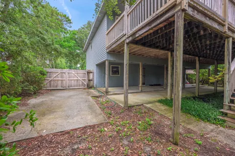a view of a house with backyard and a patio