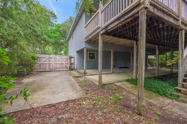 a view of a house with backyard and a patio