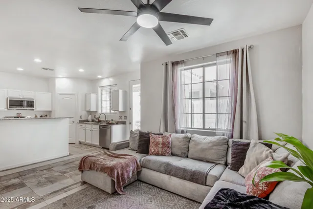 a living room with furniture and a window