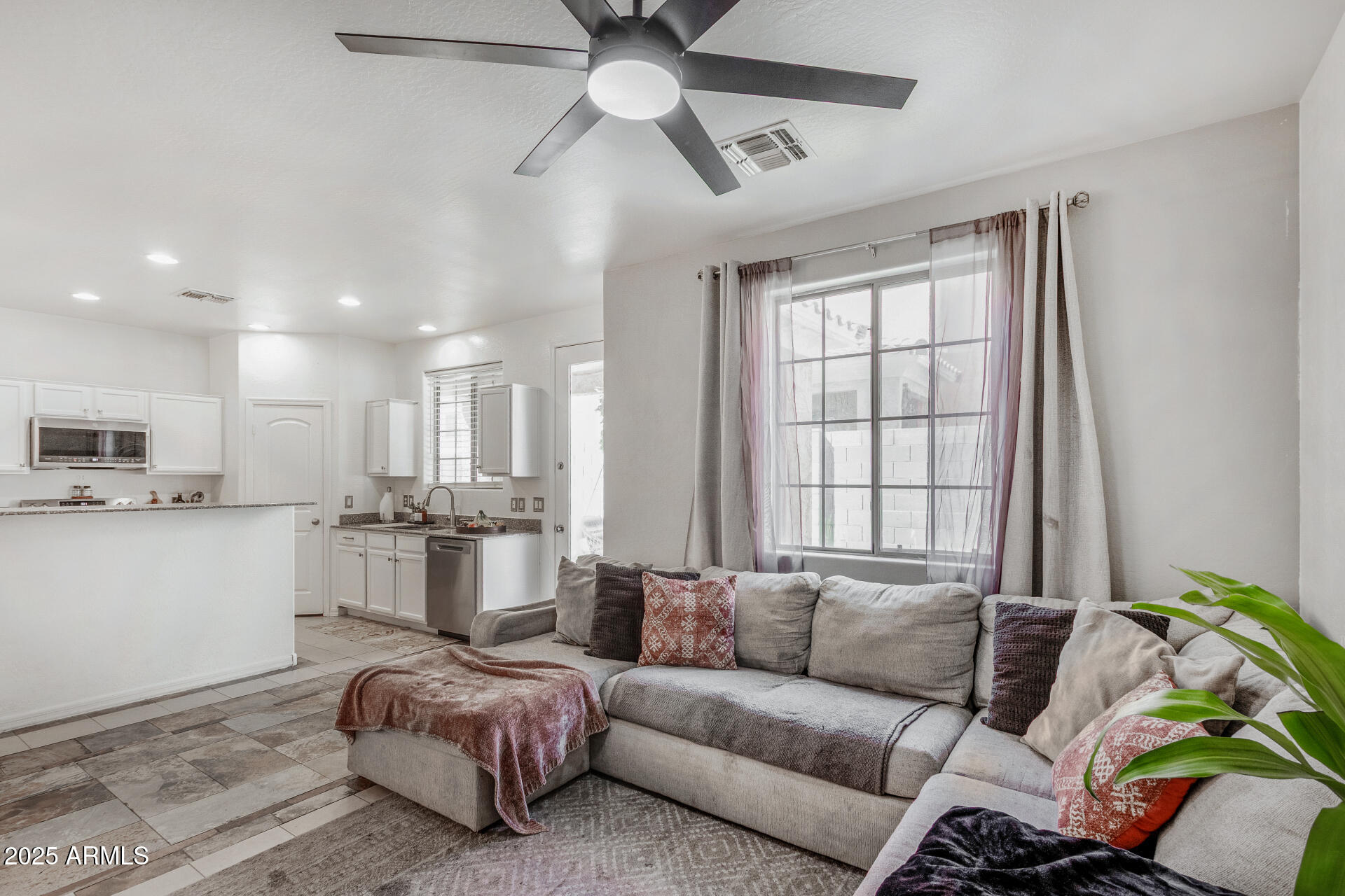 1732 South Desert View Place Apache Junction, AZ 85120 - Photo 2 of 15 a living room with furniture and a window