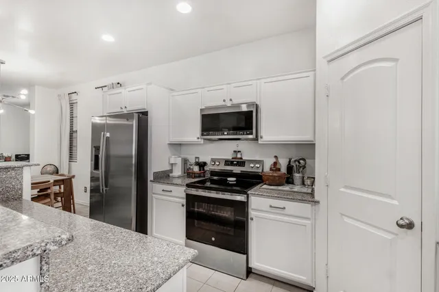 a kitchen with a refrigerator stove and sink