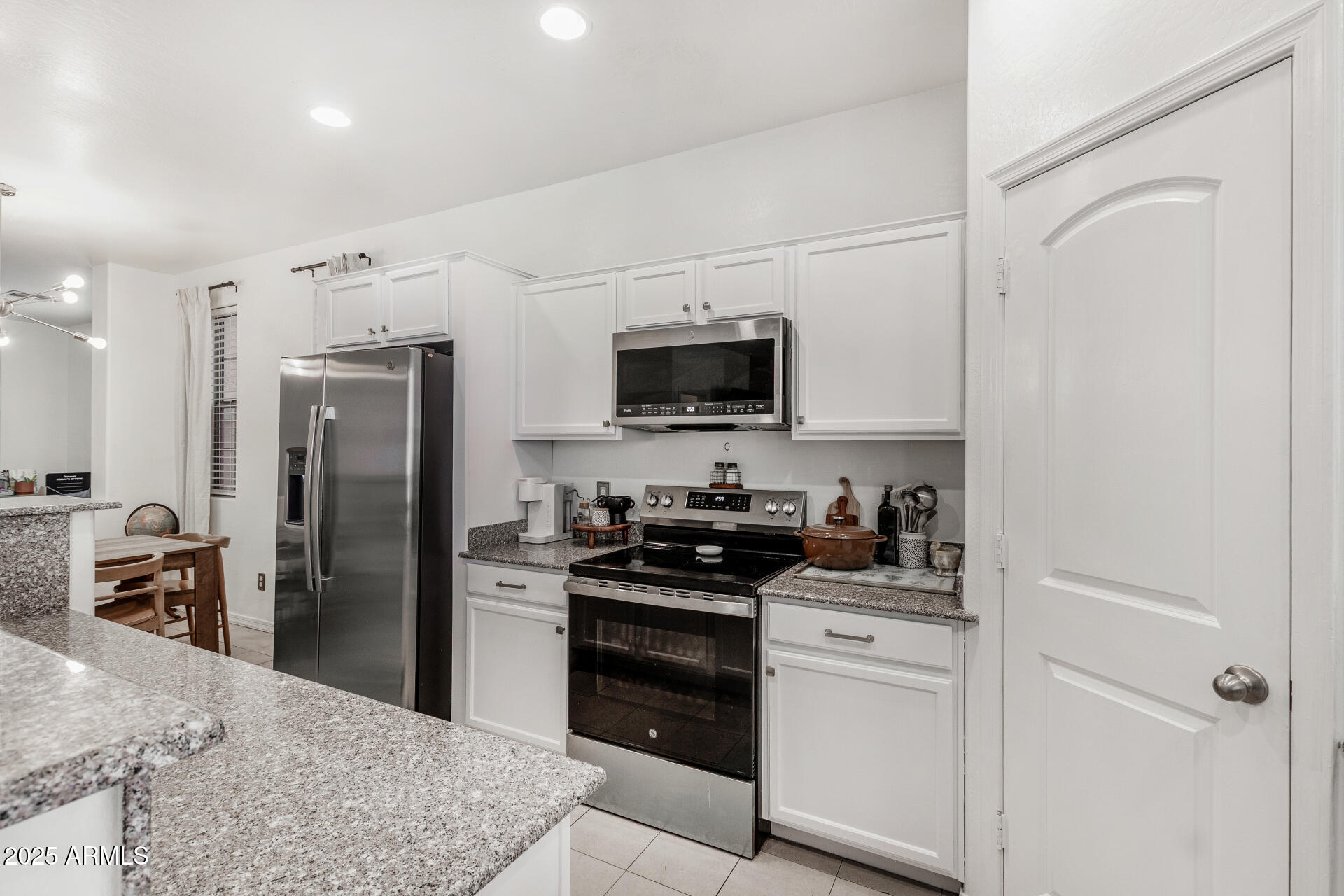 1732 South Desert View Place Apache Junction, AZ 85120 - Photo 4 of 15 a kitchen with a refrigerator stove and sink