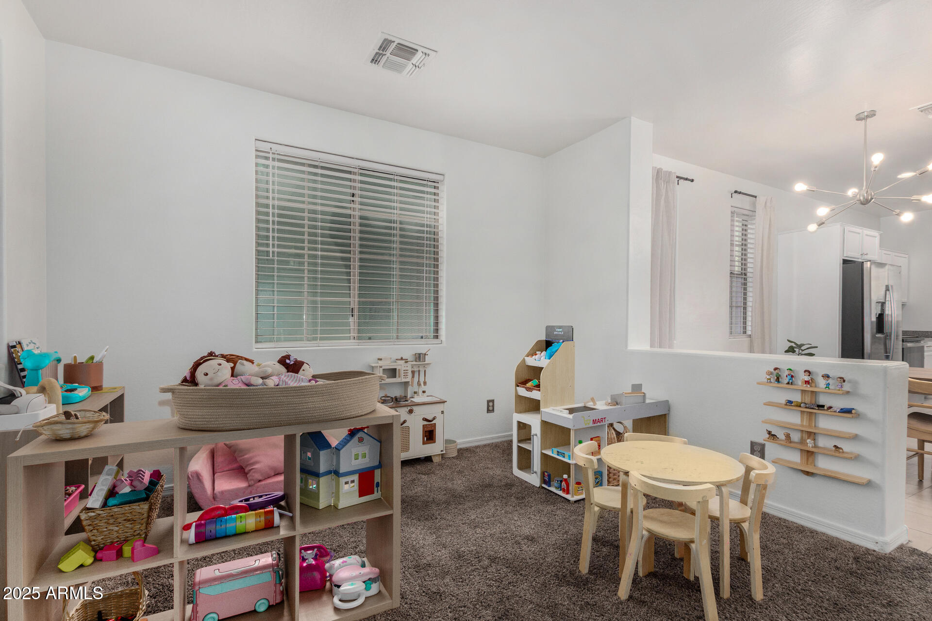 1732 South Desert View Place Apache Junction, AZ 85120 - Photo 5 of 15 a room with furniture a rug toys and a window